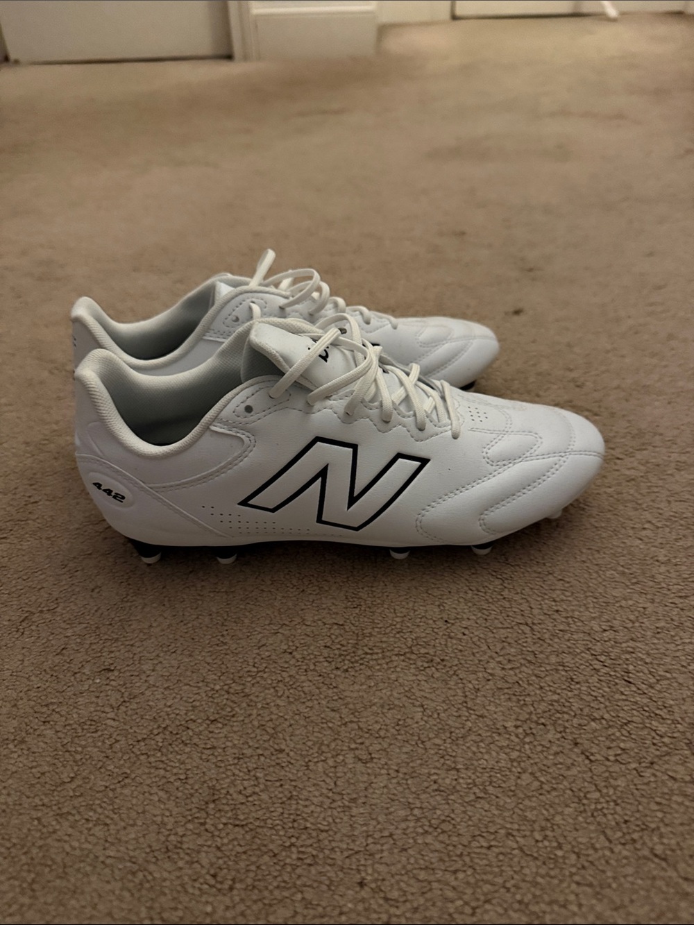 New Balance White Soccer Cleats with Black Logo